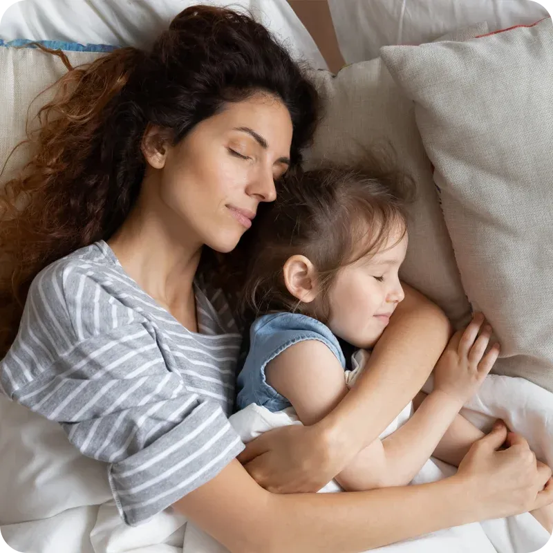 mother and daughter sleeping peacefully