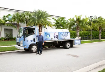 tech-standing-in-front-of-truck